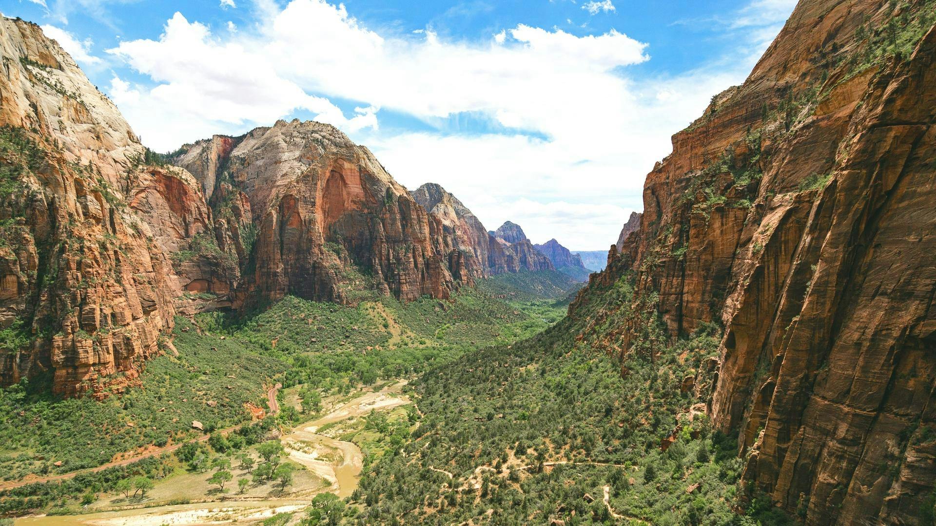 Green valley and red rock formations at Zion National Park.