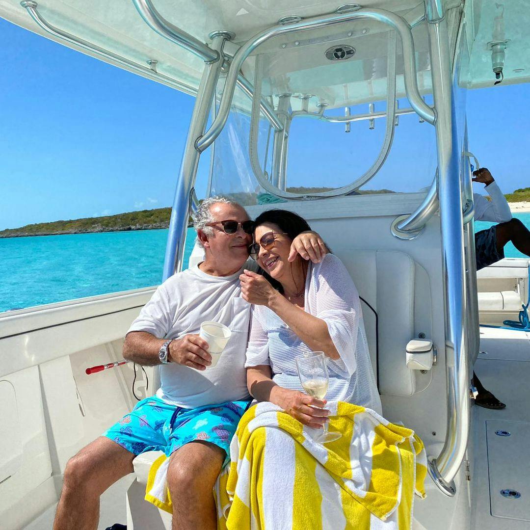 Bukitt's customers Andrés and Ileana embracing in a boat at Exumas.