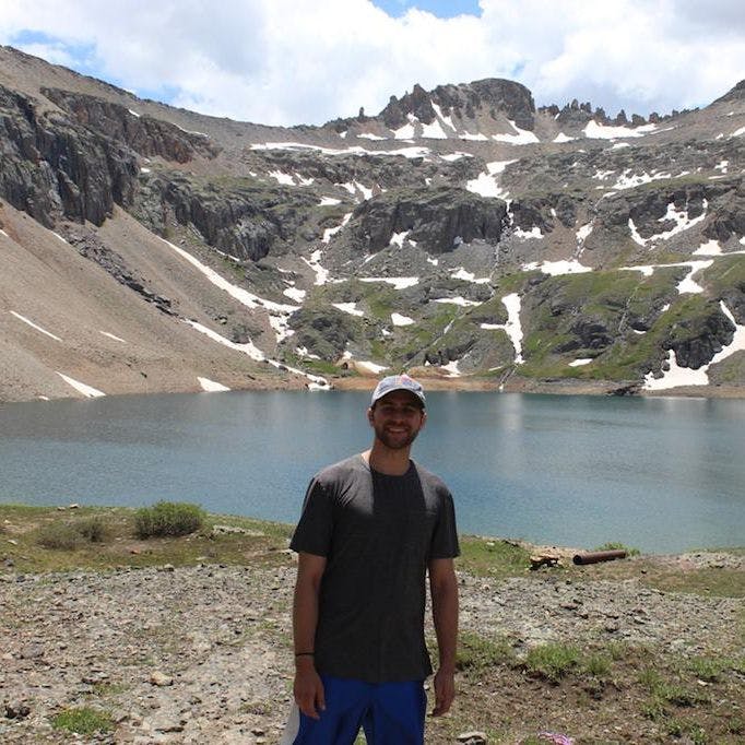 Bukitt's customers Kevin posing in front of a lake in Colorado.